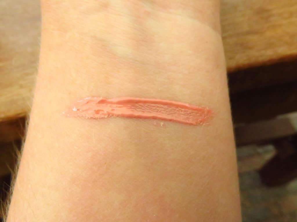 Swatch dirty little secret lipgloss in de kleur Bare