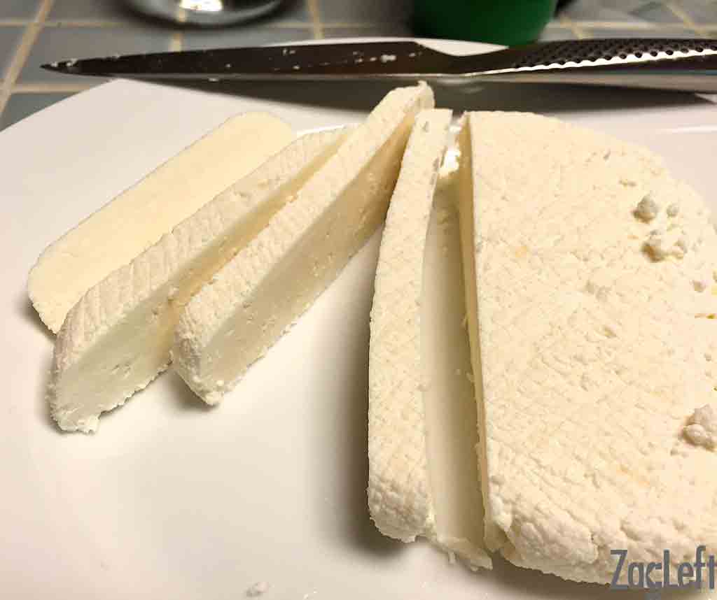 Fresh sliced paneer on a cutting board