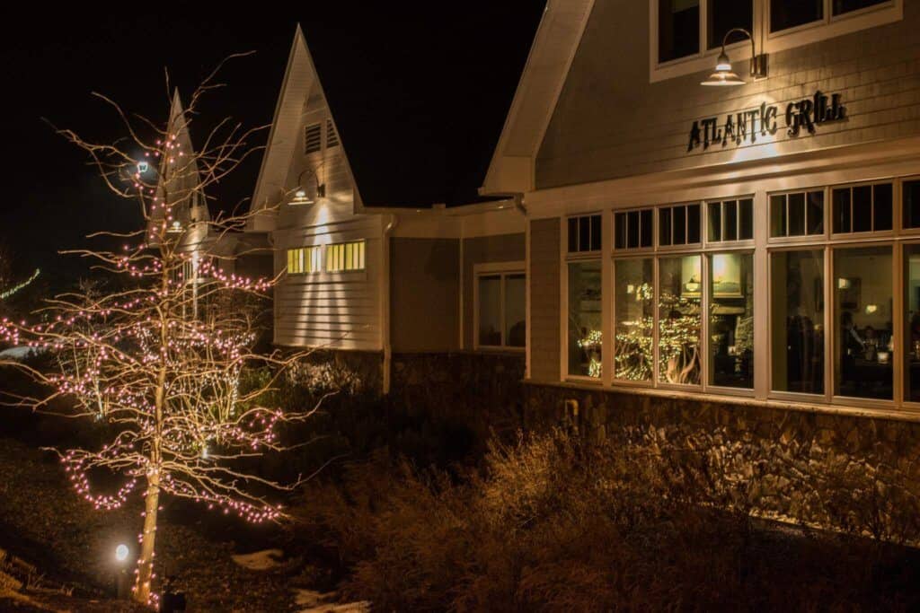 The outside of the Atlantic Grill in Rye, New Hampshire at night.