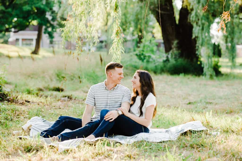 couple sitting on the grass