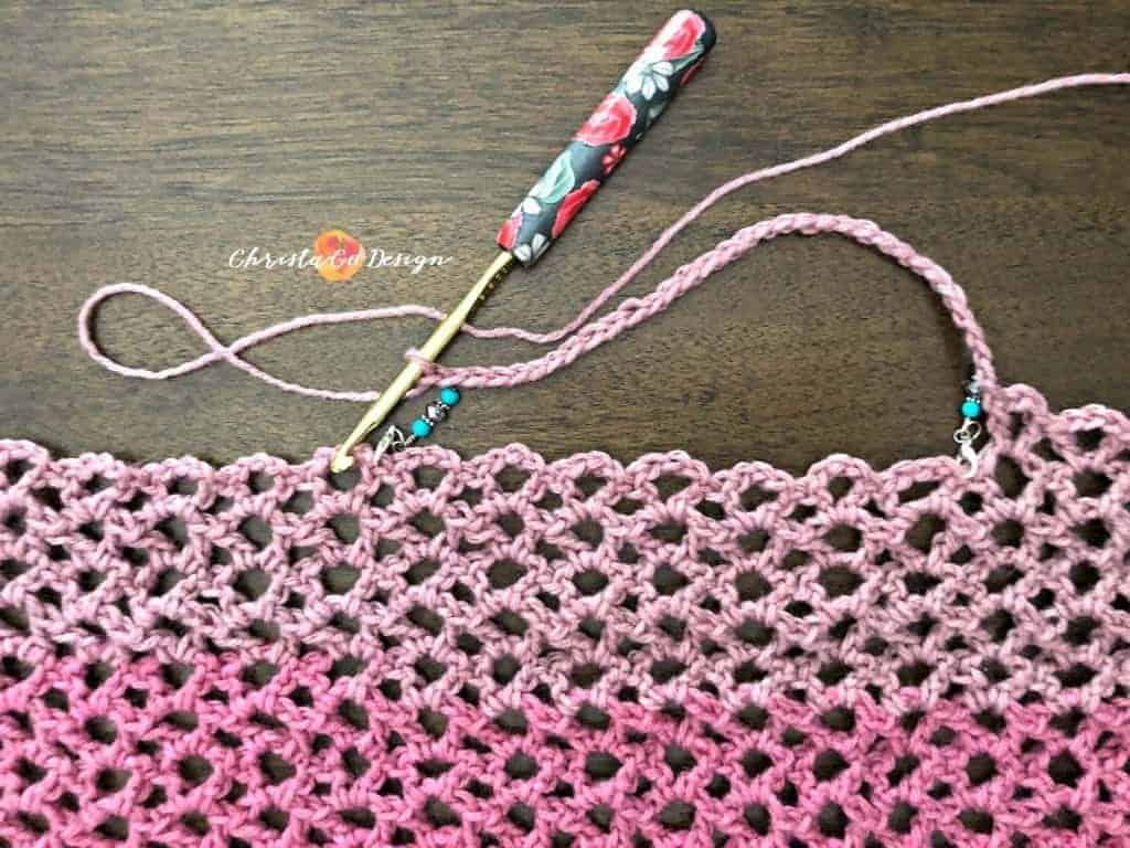 picture of pink crochet lace poncho neckline chain
