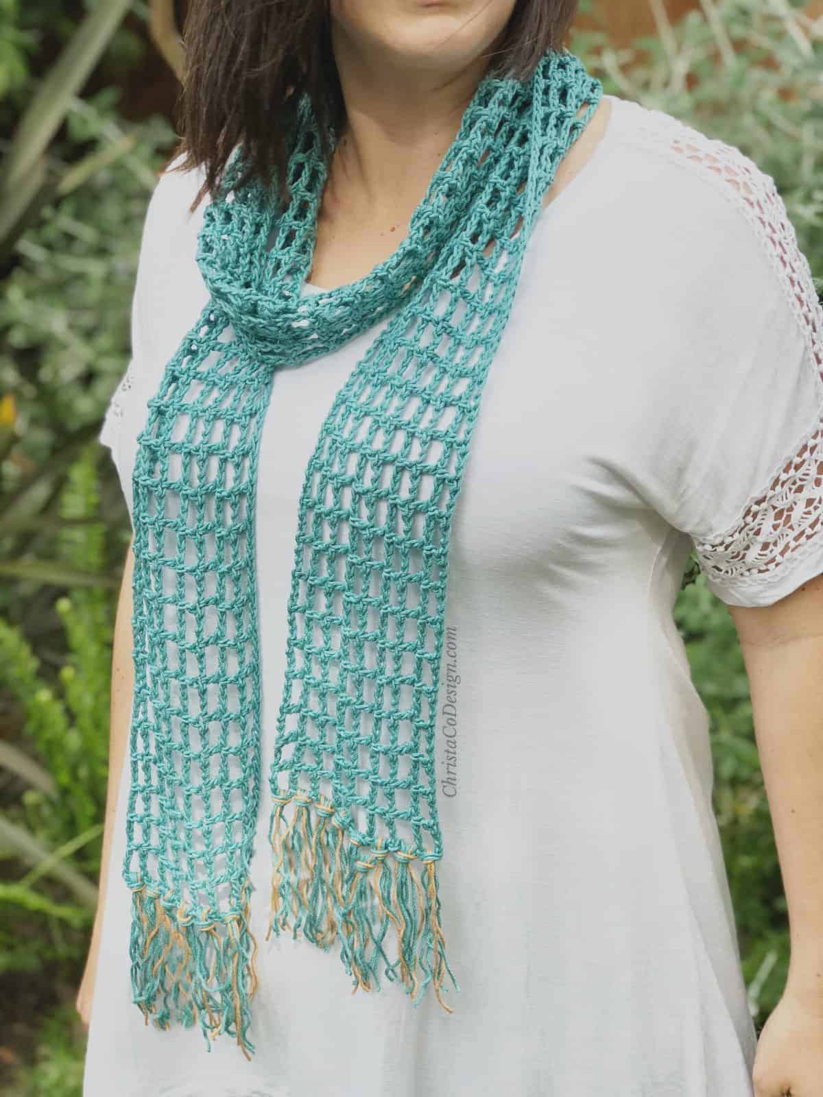 picture of woman wearing teal lace skinny summer scarf