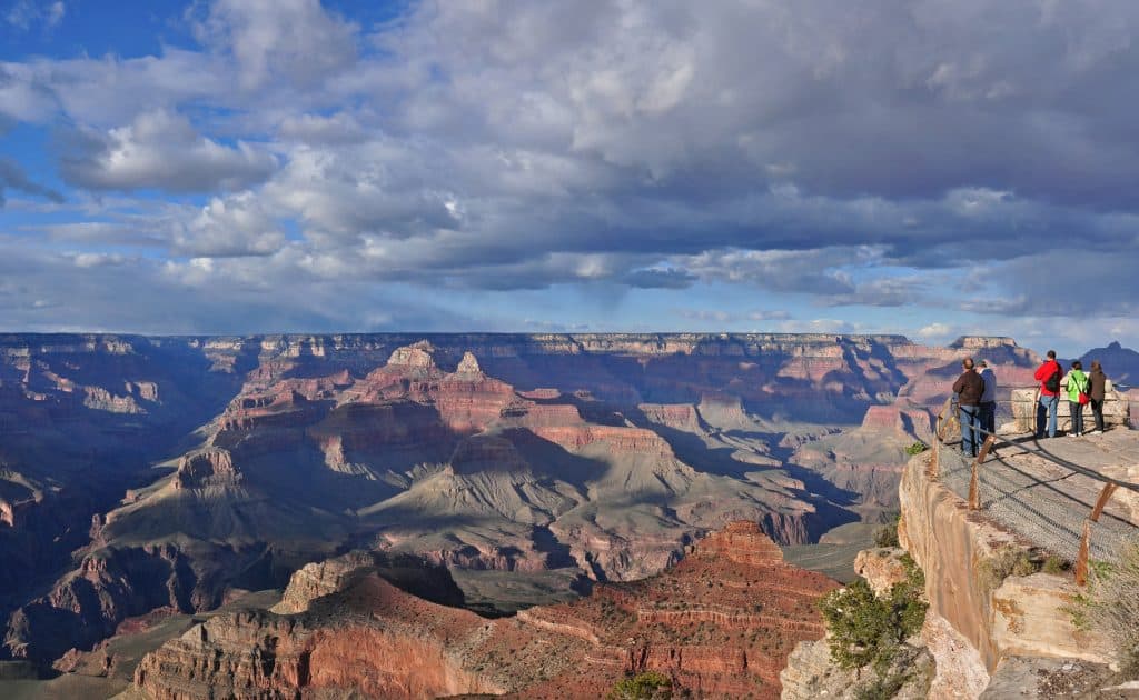 A view of people looking out into the Grand Canyon