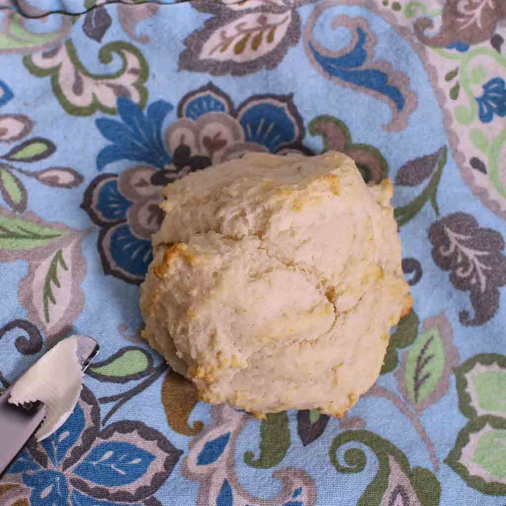One biscuit on a blue cloth napkin