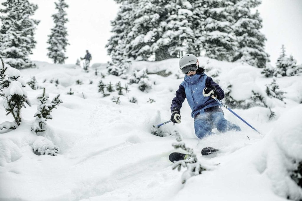 Winter_header_Powder <b>Kid skis in powder in Vail, CO.</b>