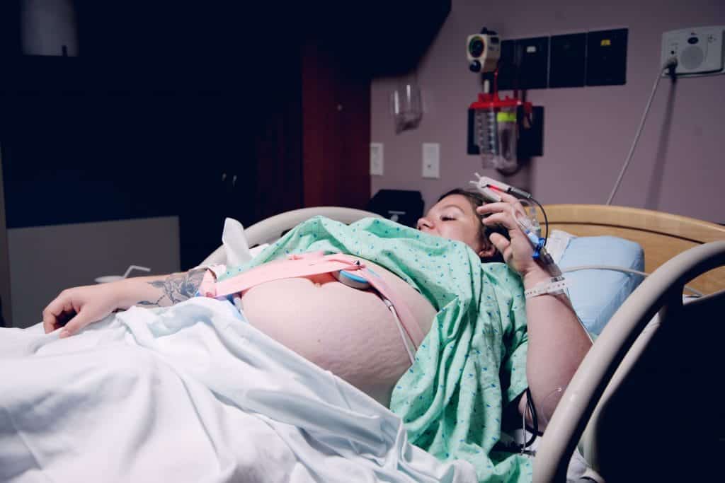 Woman laboring in hospital on back can increase pain during labor and childbirth.