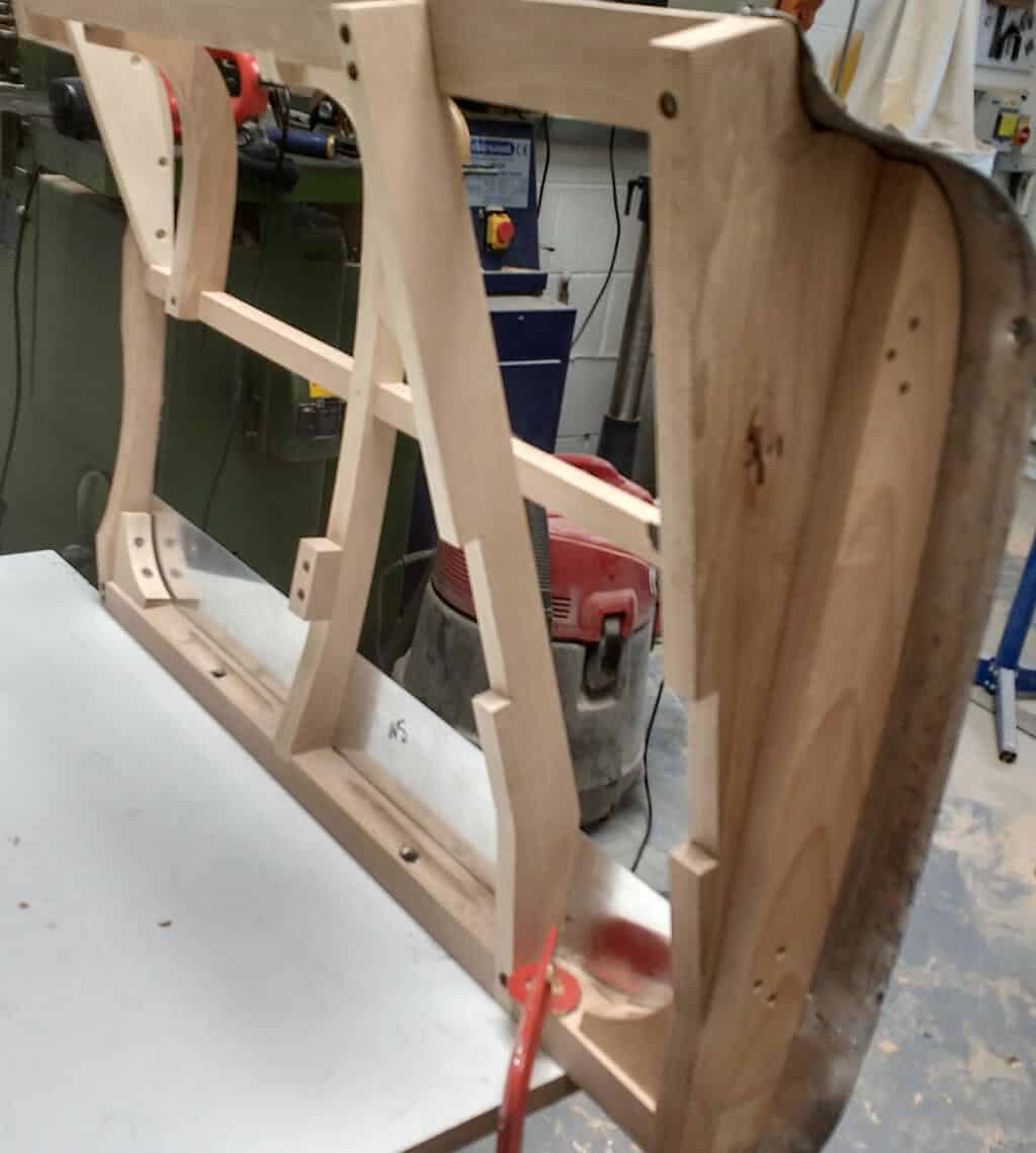skilled carpenter to shape and bend the wood to fit the body of the AC