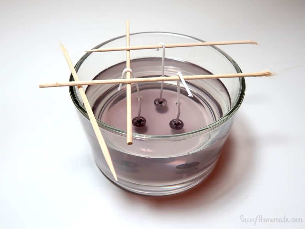 Using bamboo skewers is a good way to keep your pre-waxed wicks in place