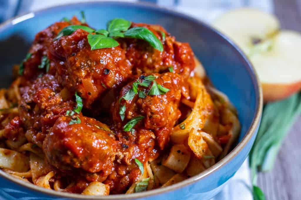 Slow Cooker Pork and Apple Meatballs served with pappardelle pasta