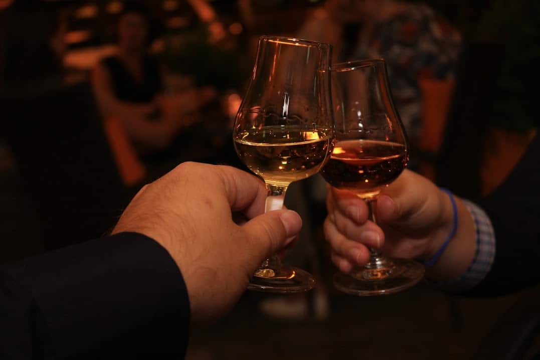 white wine drinking couple night