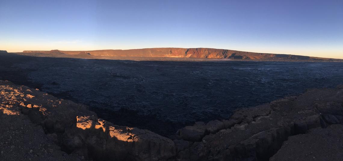 An early morning view looking north across Moku‘āweoweo, Mauna Loa's summit caldera, from a spot near the summit cabin on the volcano's south caldera rim. Photo by M. Patrick, 09-08-2019, USGS, public domain.