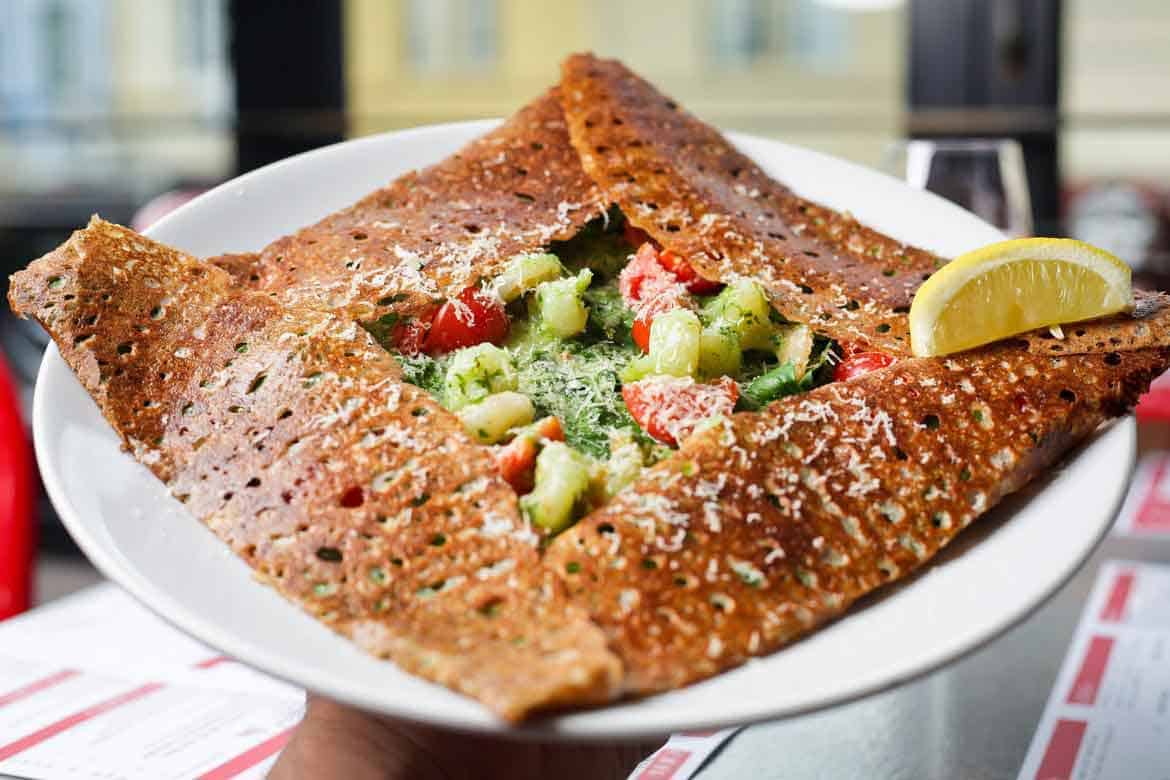 Savoury galette with garlic, parsley, prawns, spinach, cherry, tomato and Parmesan