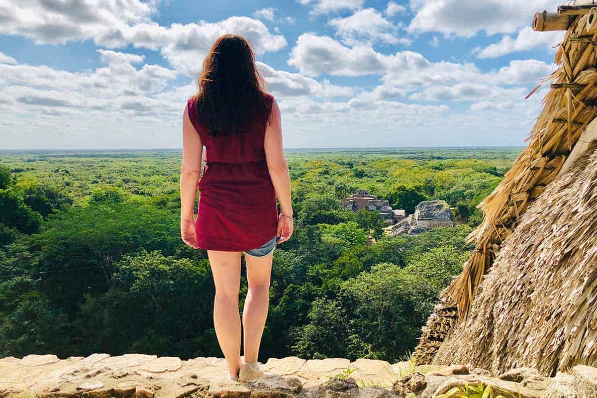 View from the Acropolis at Ek' Balam. Did you know you can CLIMB on the ruins in Ek' Balam, Mexico?? Yep- the Ek' Balam ruins near Valladolid is one of the last Mayan sites where you are allowed to look inside rooms, climb to the top of the pyramids and imagine life thousands of years ago. This post tells you EXACTLY how to get there, what you need to bring and do when you are visiting Ek' Balam. #ekbalam #mexico #ruins #yucatan #blackjaguar #mayanruins #ek'balam