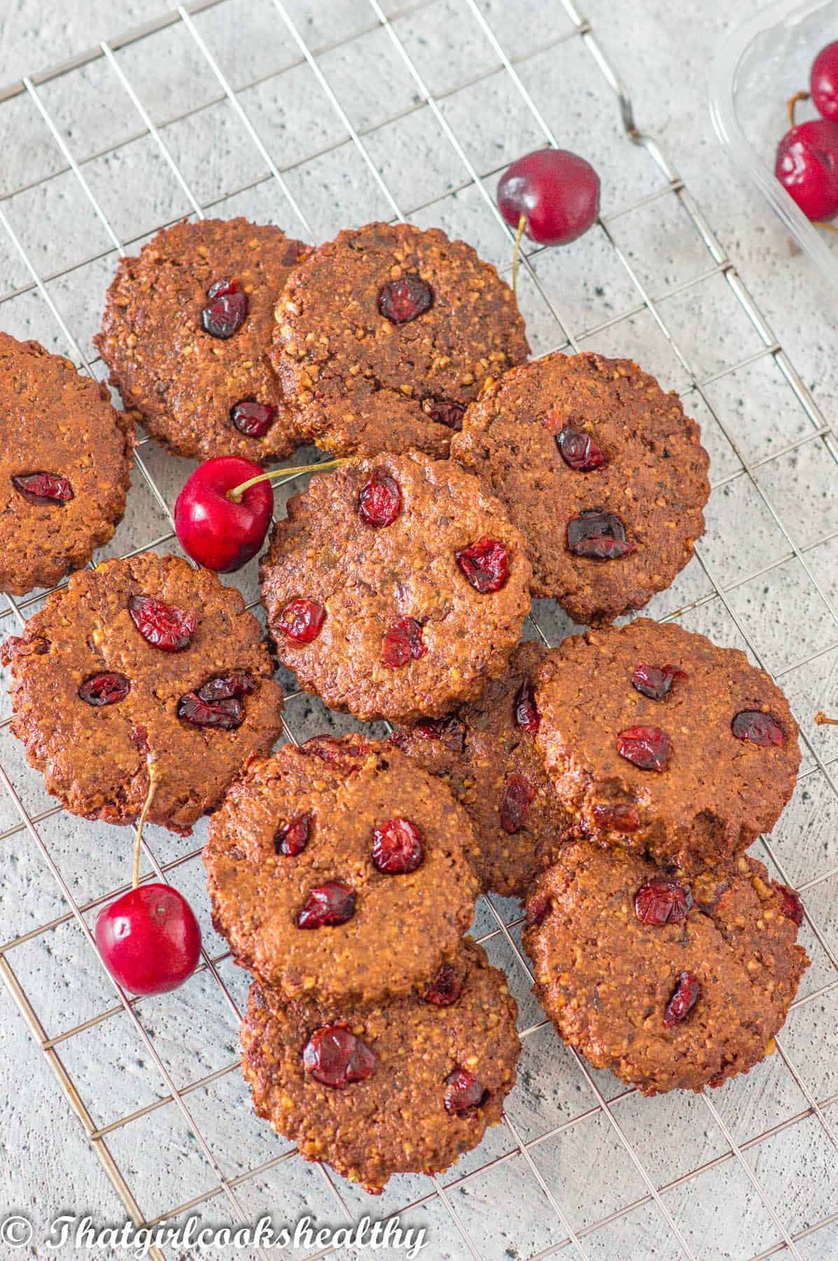 cookies with loose cherries on top
