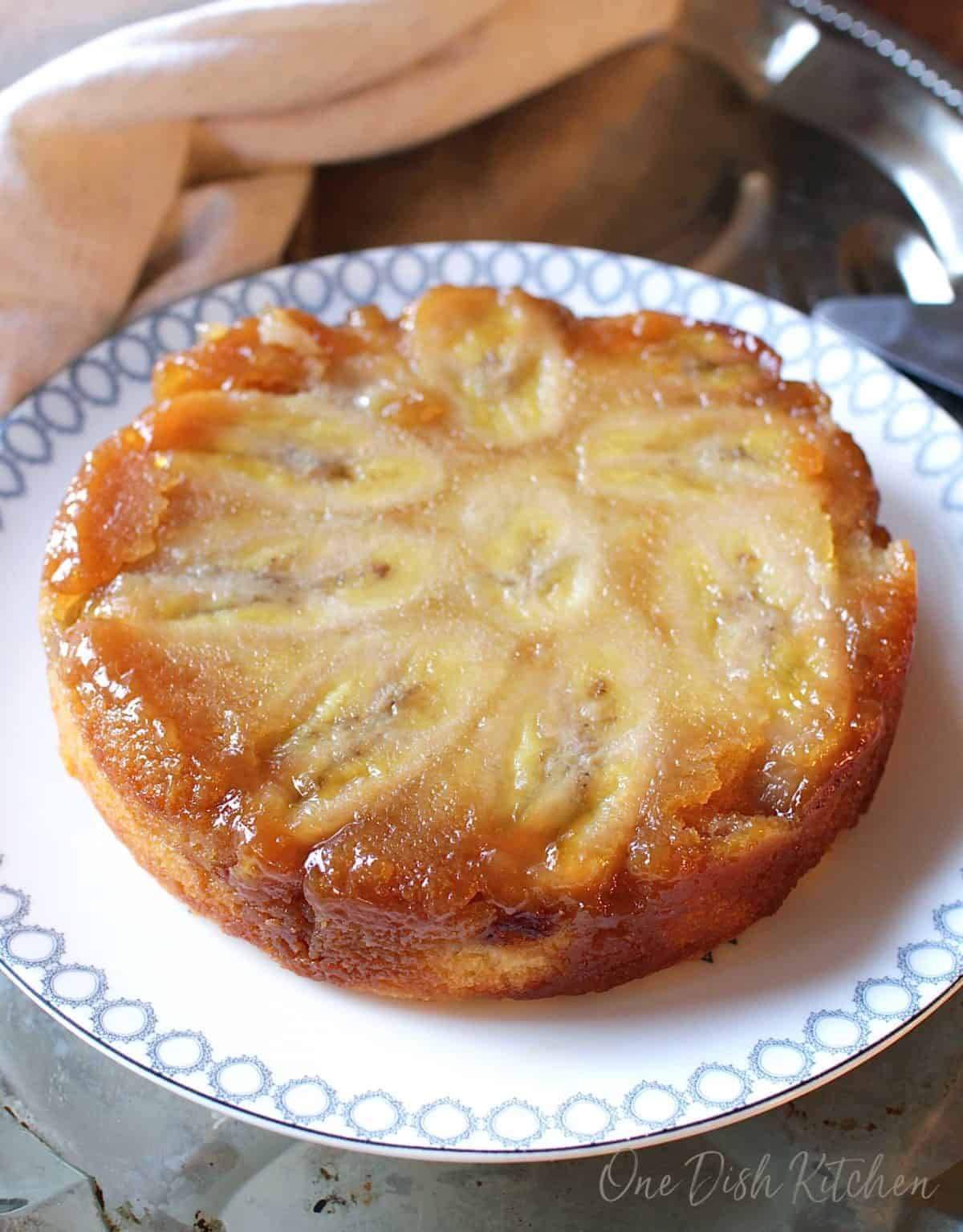 banana upside down cake on a plate.