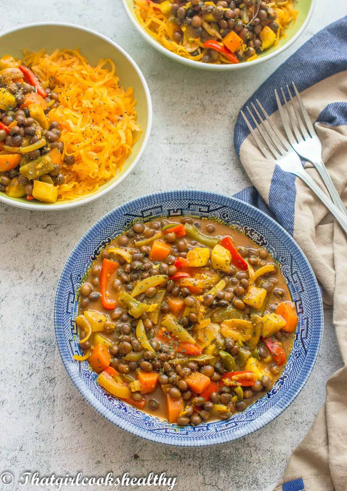 3 bowls of curry with noodles