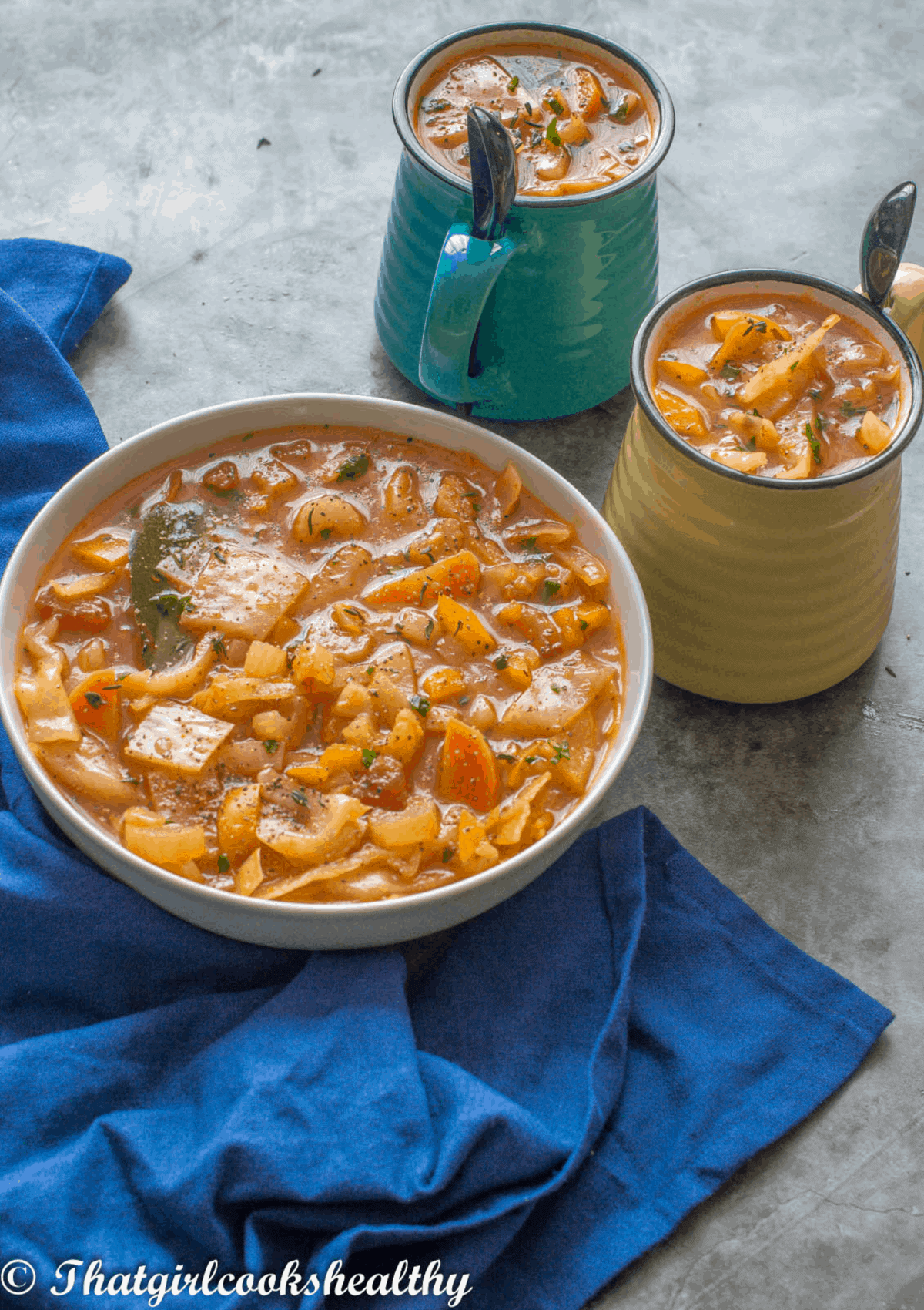 bowl of soup with mugs
