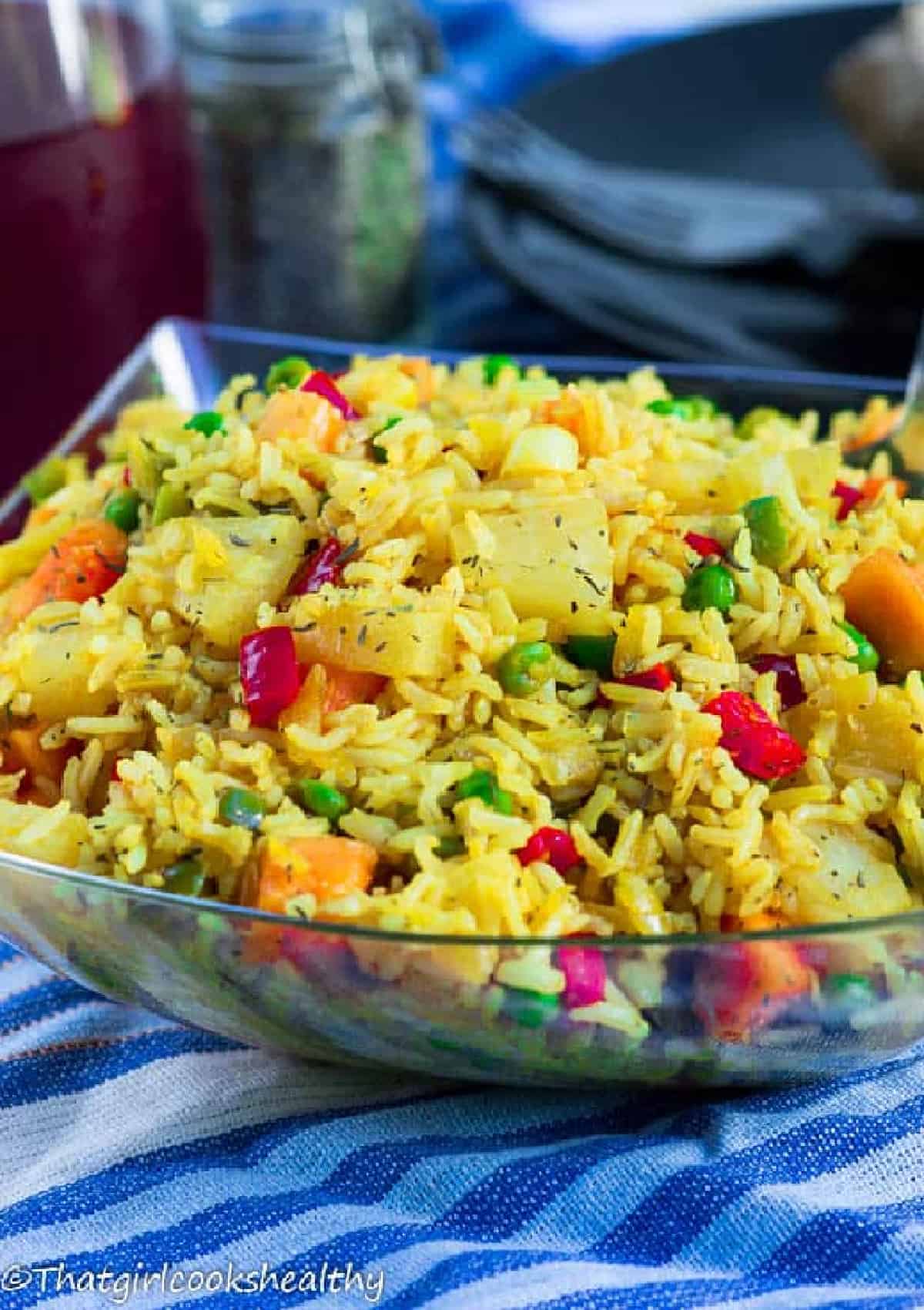 yellow rice in a clear bowl
