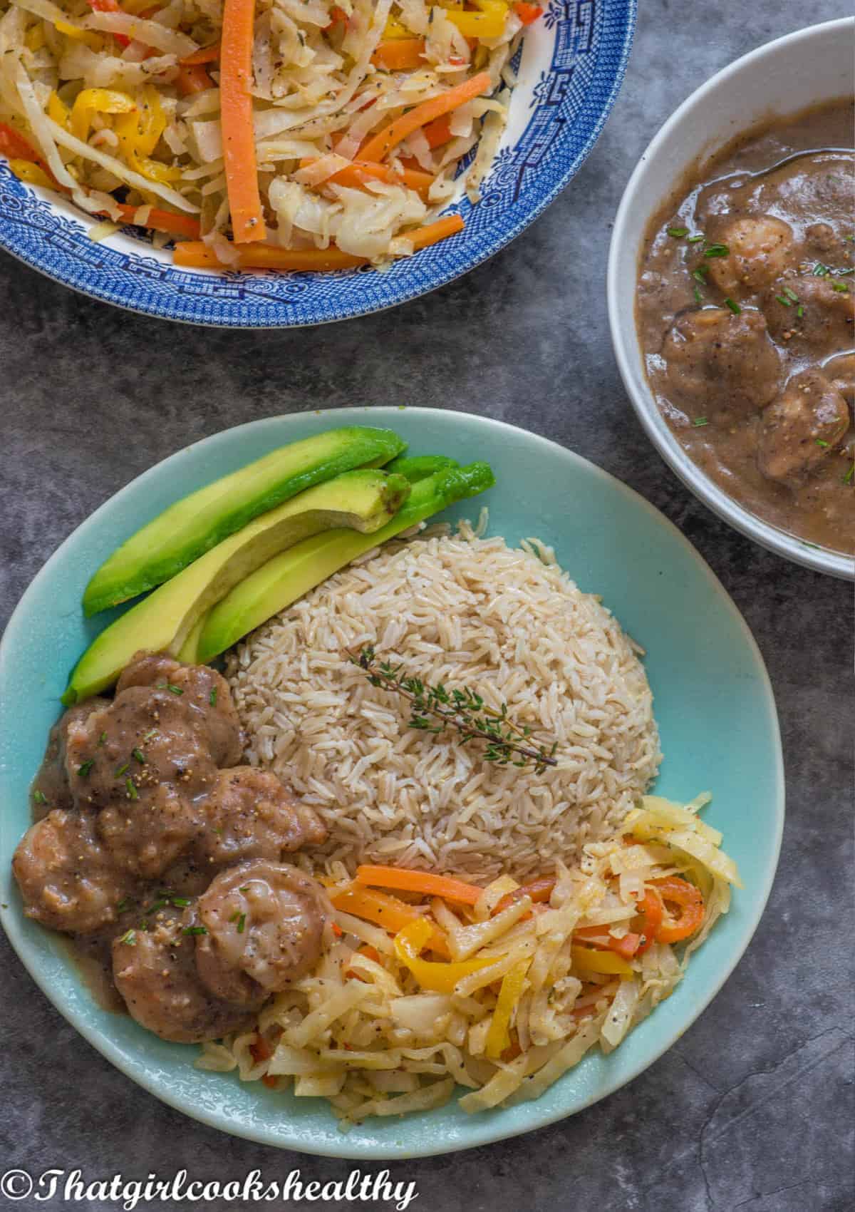 Close up of the shrimp, avocado, rice and cabbage