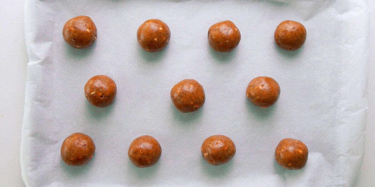 Peanut Butter Cookie balls on parchment paper.