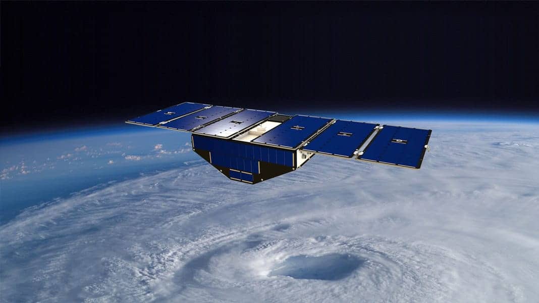 Illustration of one of the eight CYGNSS satellites in orbit above a hurricane.