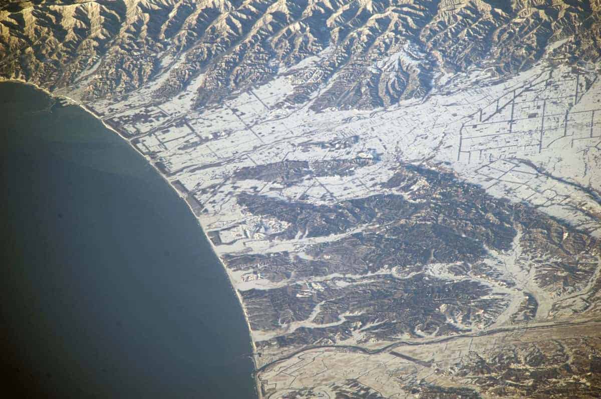 Snowfall in northern Japan captured on March 21, 2014 from the International Space Station showing Hokkaido’s east coast. Image: NASA, ISS039-E-003841