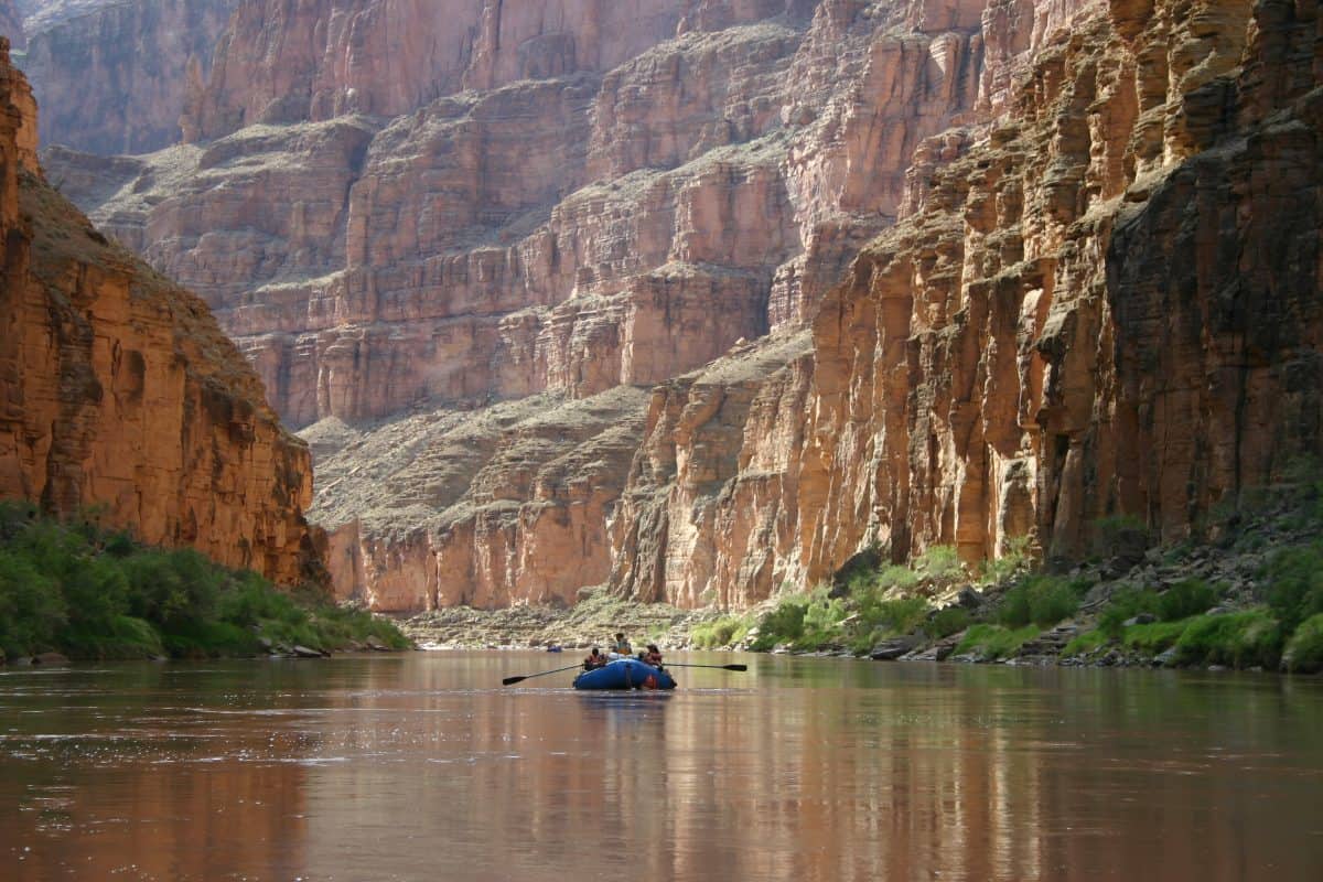 People rafting down the Colorado River in the Grand Canyon