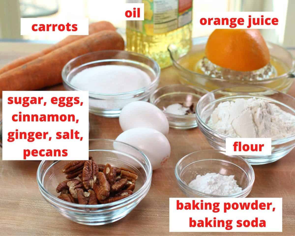 the ingredients in a carrot cake labeled and on a brown table.