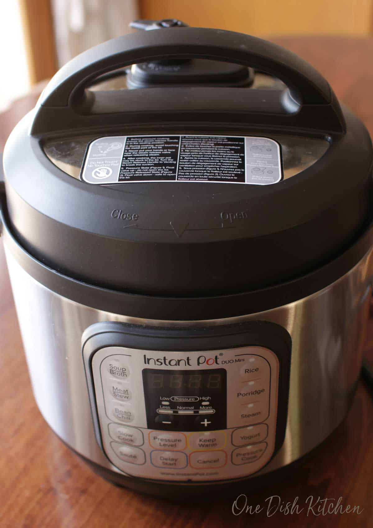 An instant pot closed with sweet potatoes inside