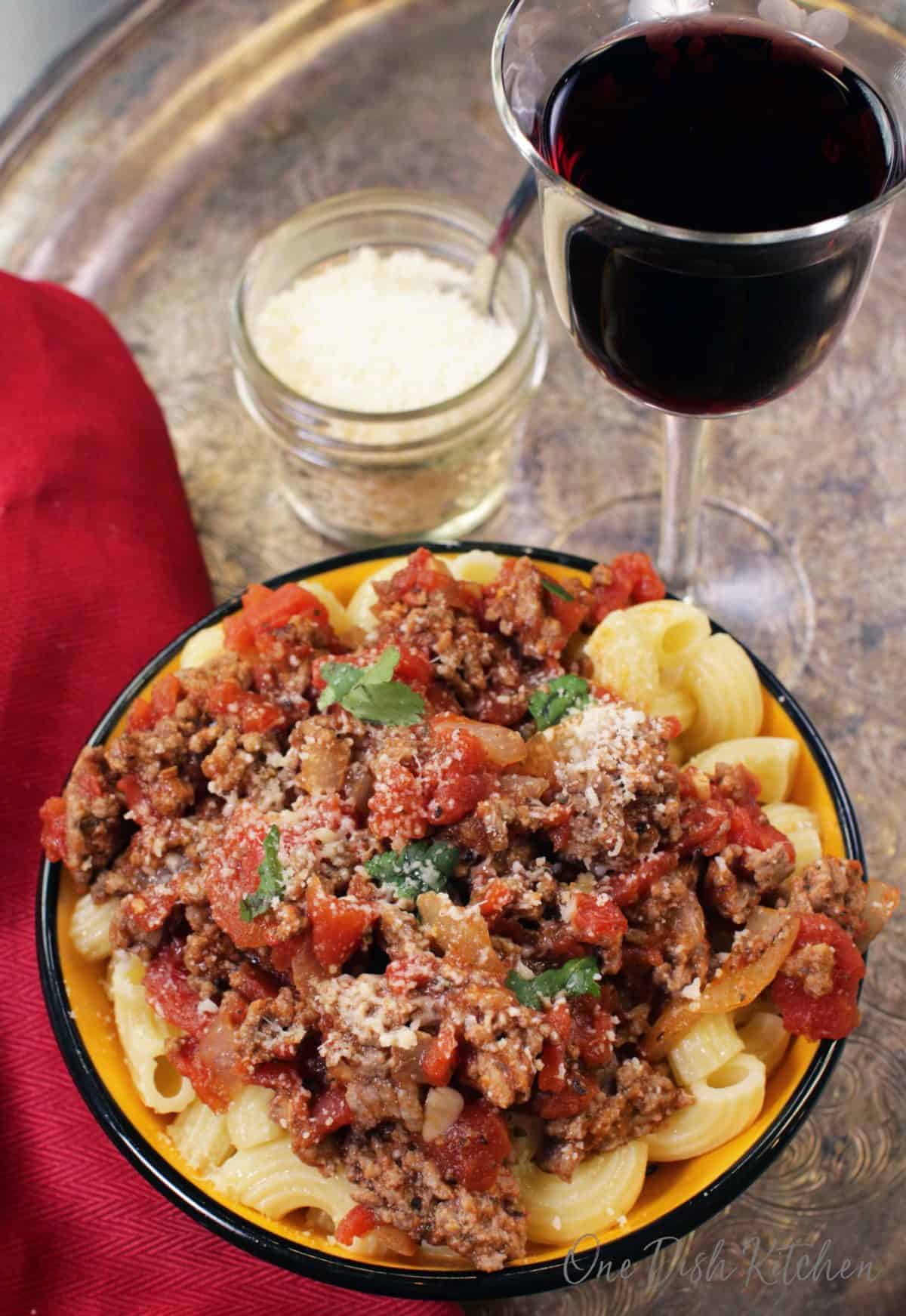 an overhead view of a bowl of spaghetti and meat sauce.