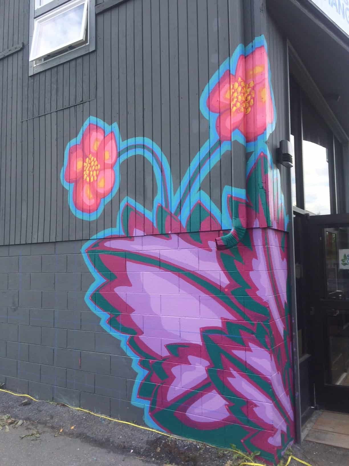 flower mural on side of building