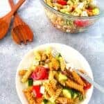 Easy Slimming World tomato and mozzarella pasta salad recipe 53 pasta salad served on a plate next to a bowl of pasta salad