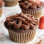 Healthy chocolate frosting piped onto a chocolate cupcake.