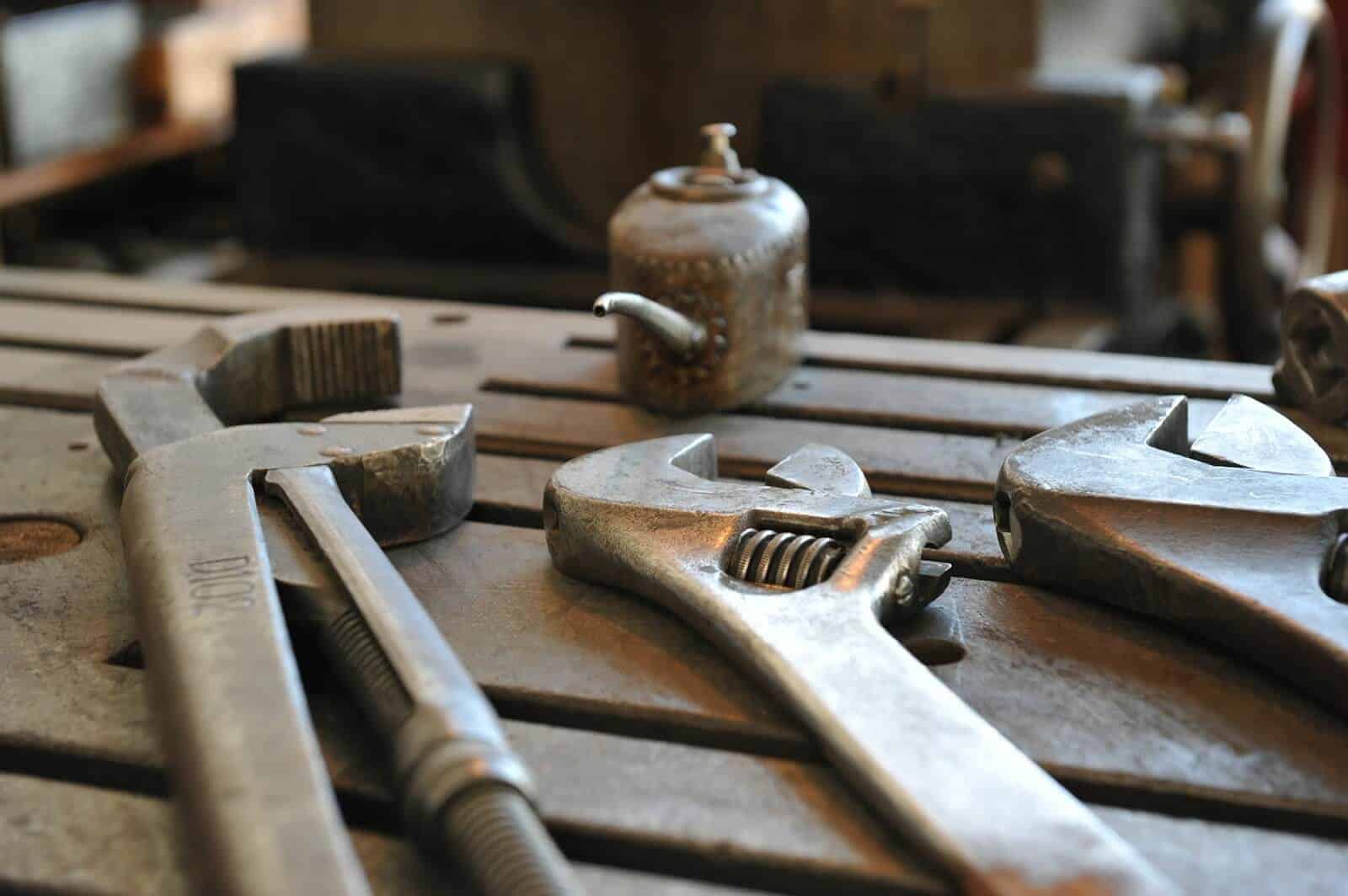 Three wrenches and oil can