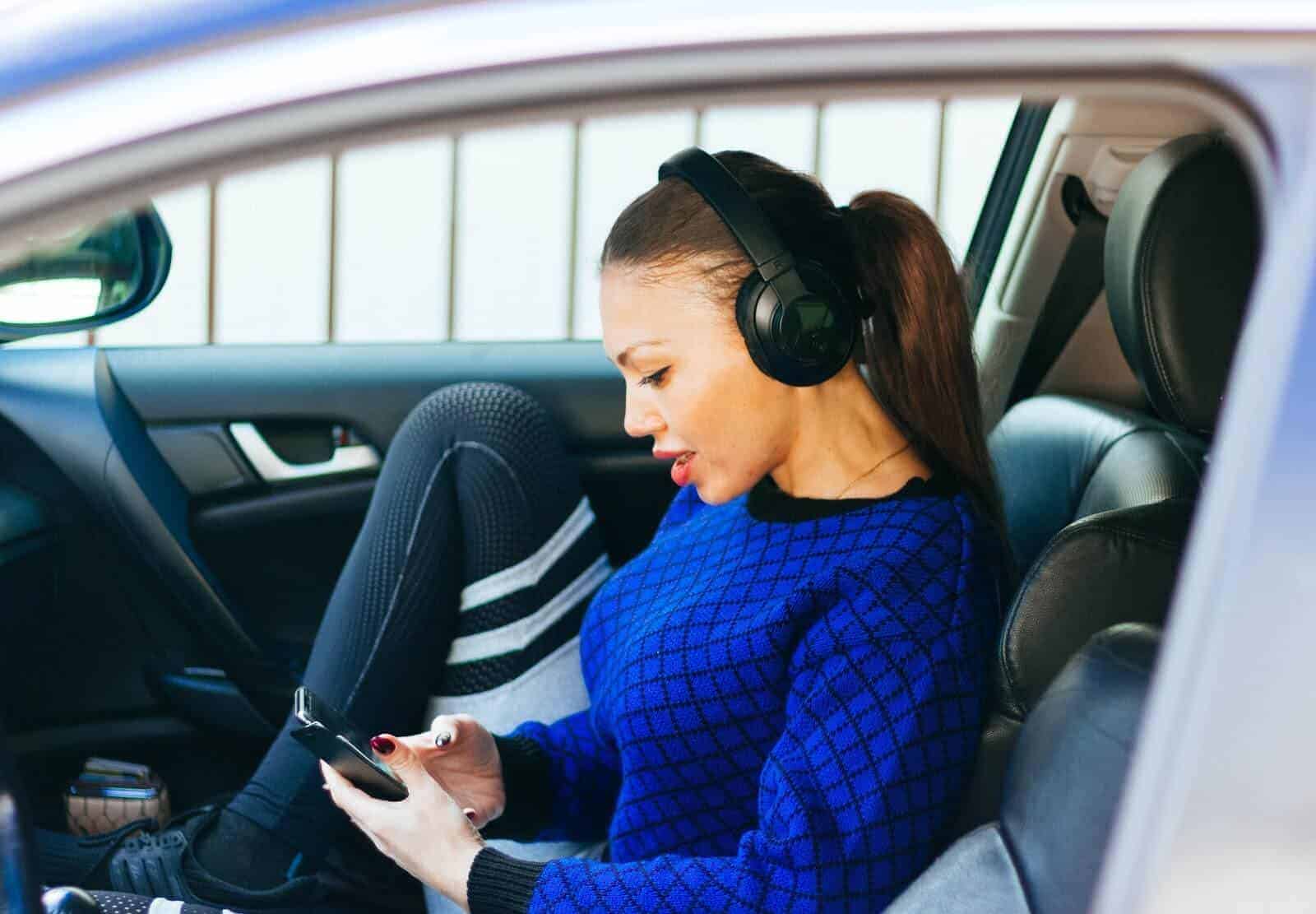 Woman sits in passenger seat of car