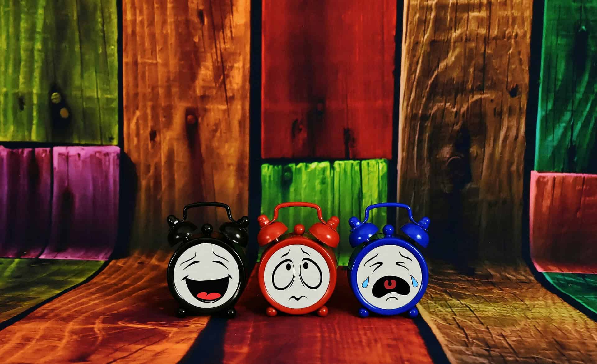 3 alarm clocks, one laughing, one worried one crying, like us on the morning routine school run