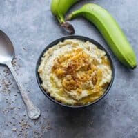 mash in a black bowl with spoon