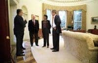 Photo of Head of the spymasters CIA Director George Tenet speaking with Condi Rice, George Bush and Dick Cheney in Oval Office