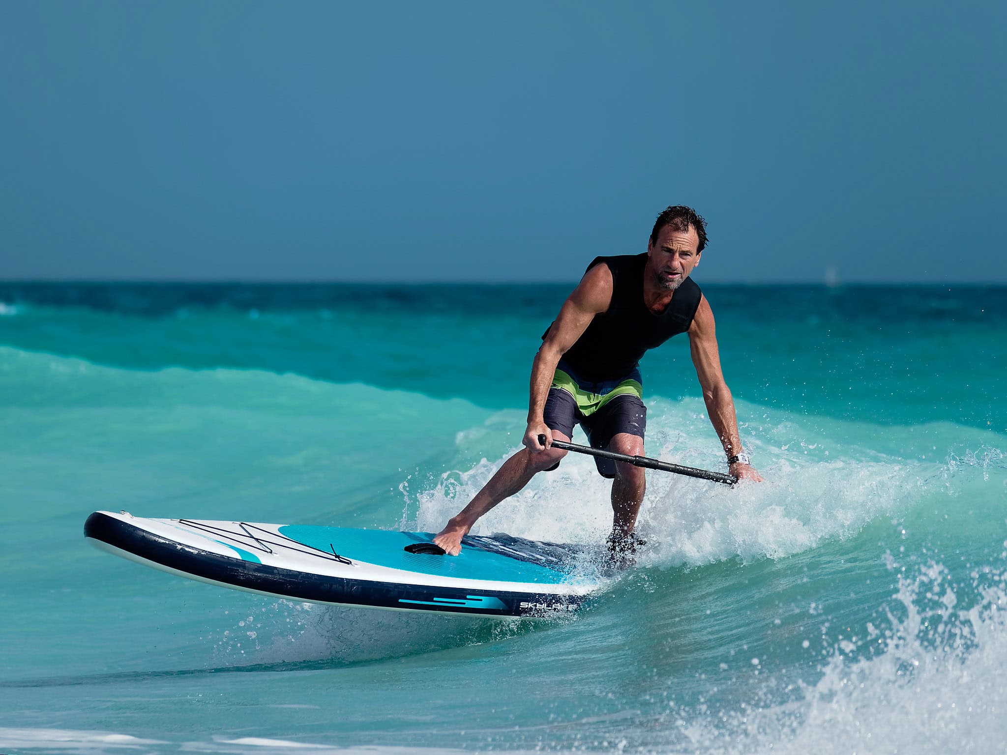 Man surfing an inflatable SUP