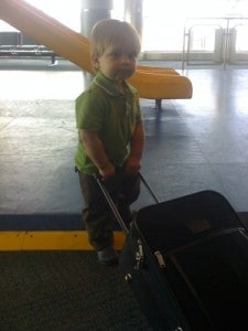 Bub At Airport (300 x 400) flying with a toddler, flying with baby, passport, baby airport, baby suitcase, passport for baby, need a passport