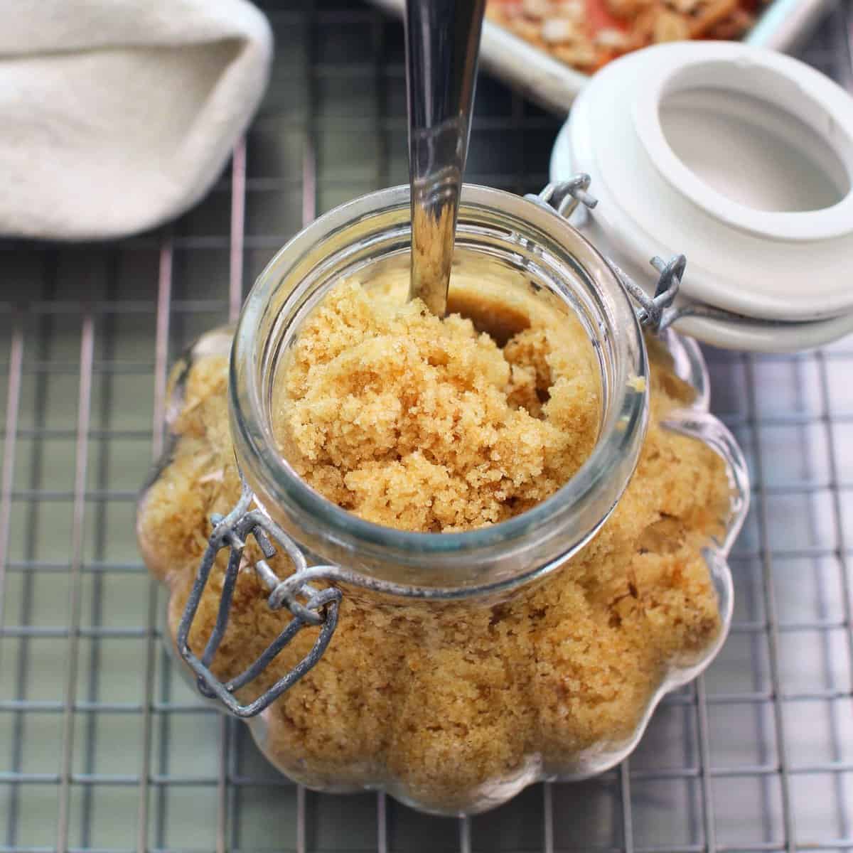 a small jar of brown sugar next to a cooling rack.