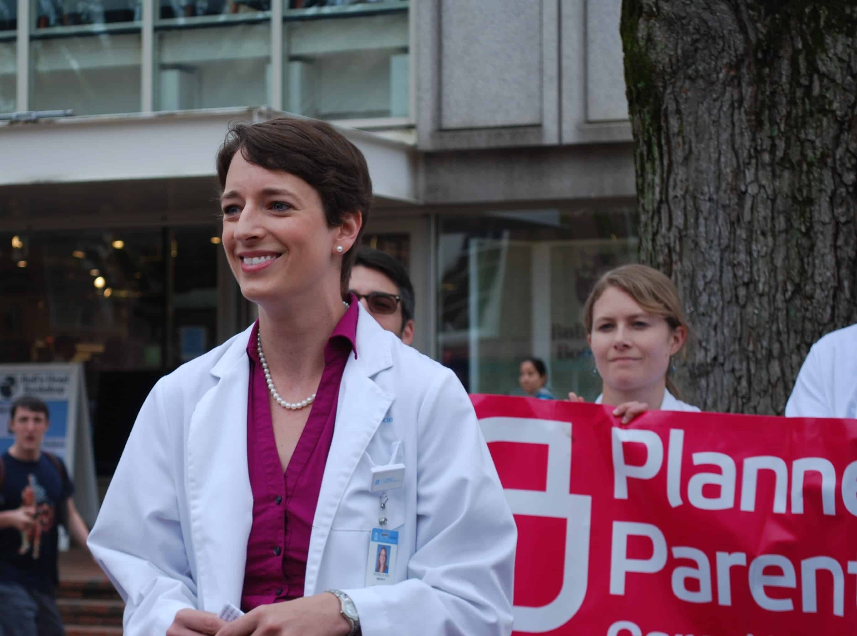 Michelle Brown speaking at a rally