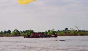 tourist boat trying to spot Irrawaddy dolphins