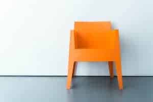 An orange chair. Photo by Rabie Madaci