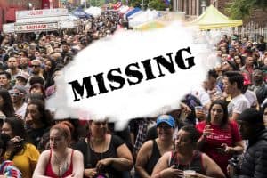 A mixed crowd, with an "erased" area in the middle, with the word MISSING.