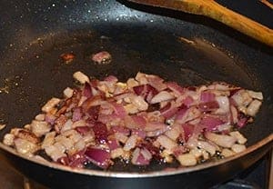 Finely chopped onions being sautéd - The Irish Place