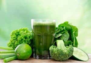 Glass of Green Juice glass of green juice plus vegetables made by juicing in your home