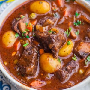 beef stew with slow braised beef, potatoes, carrots and parsley