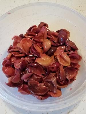 grape hulls in a container