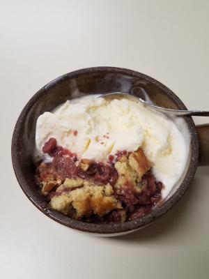 grape hull cake with ice cream in ramekin